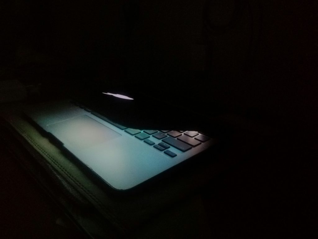 Laptop open in dark